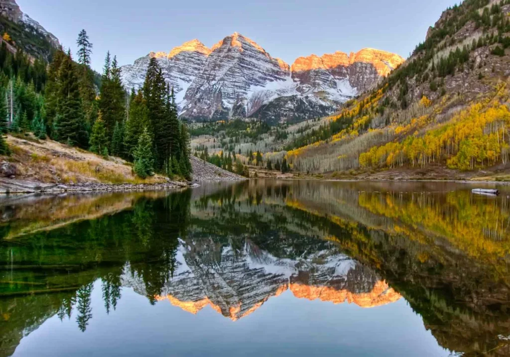 mountain-sunrise-reflected-on-lake-cash for junk cars Colorado