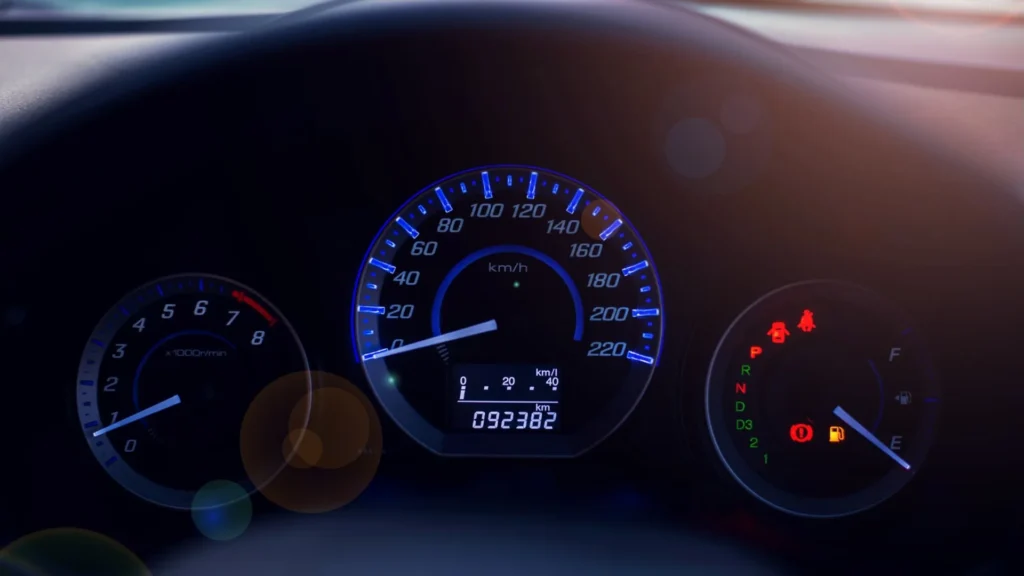 Vehicle dashboard with an odometer and mileage display