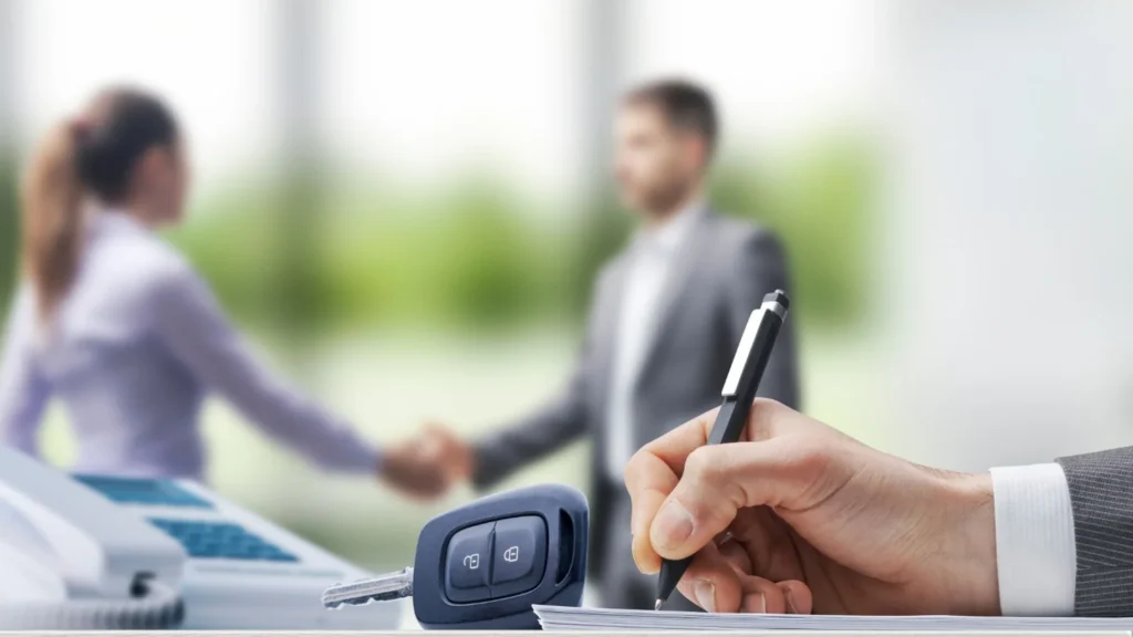 Vehicle title paperwork and car keys prepared for a Nevada vehicle sale