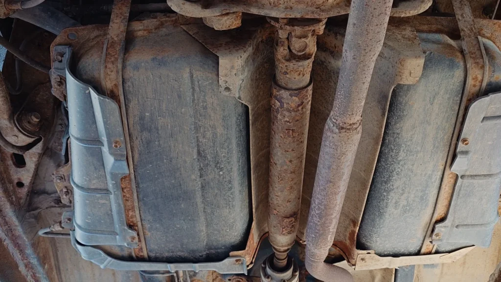 Vehicle underbody with a missing catalytic converter
