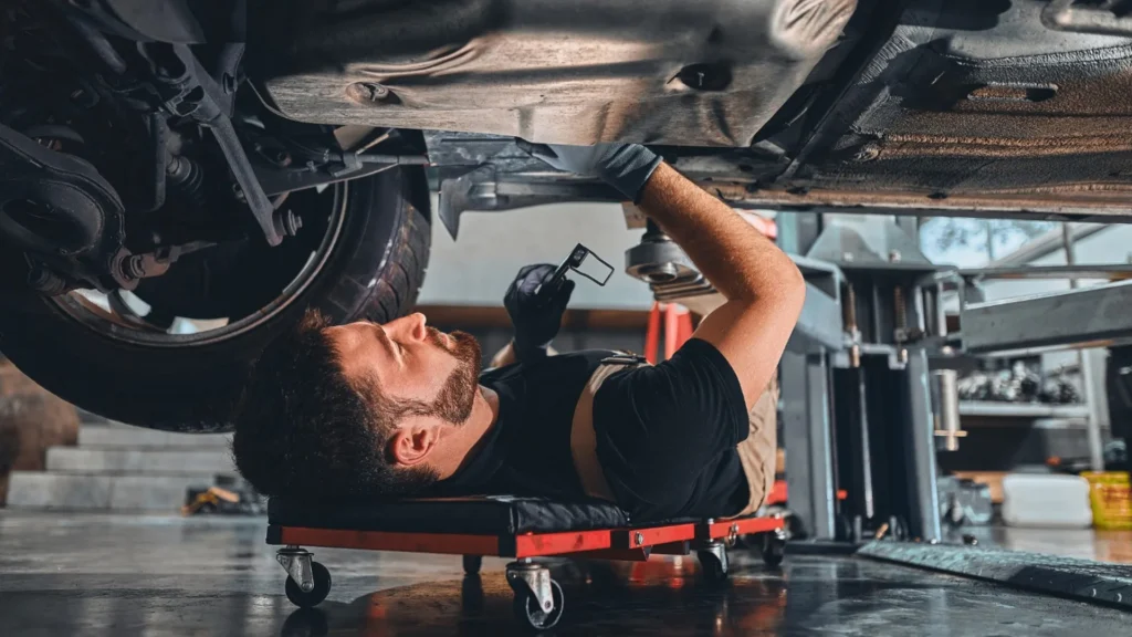 Older vehicle undergoing a failed safety inspection at a garage