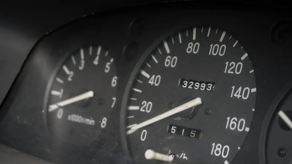 Vehicle dashboard with an odometer and mileage display