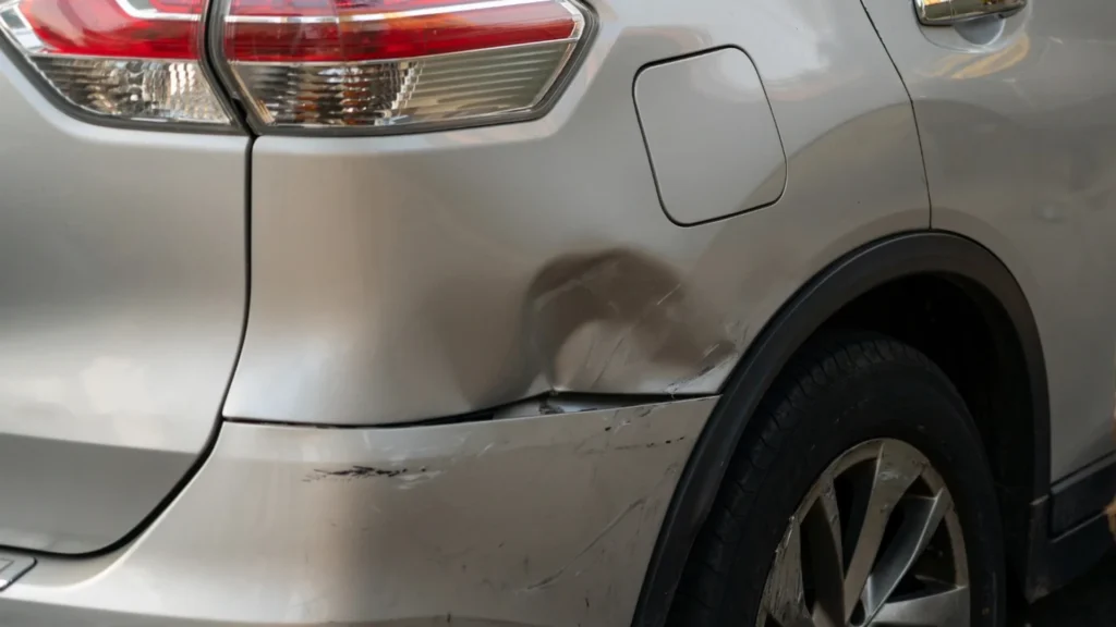 Damaged older SUV waiting for a flatbed tow
