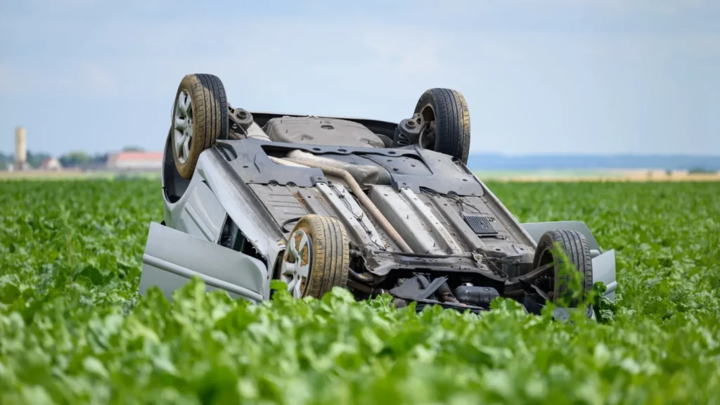 Older damaged car awaiting a tow in a rural Nevada setting