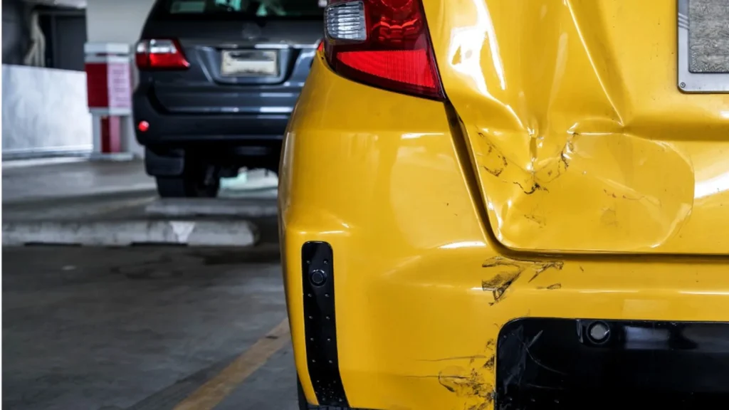 Car with rear-end collision damage waiting for pickup