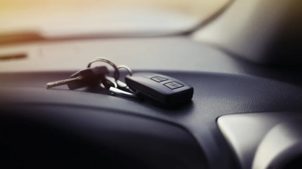 Vehicle title paperwork and car keys prepared for a Nevada vehicle sale