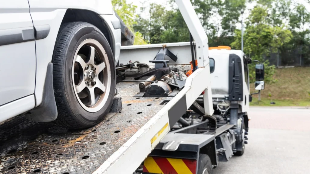 Older damaged vehicle awaiting professional pickup