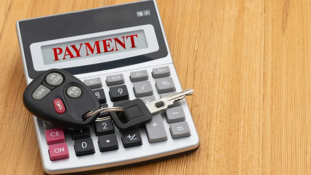 Selling a Salvage Title Car in Maine Vehicle title paperwork and car keys prepared for a Maine vehicle sale