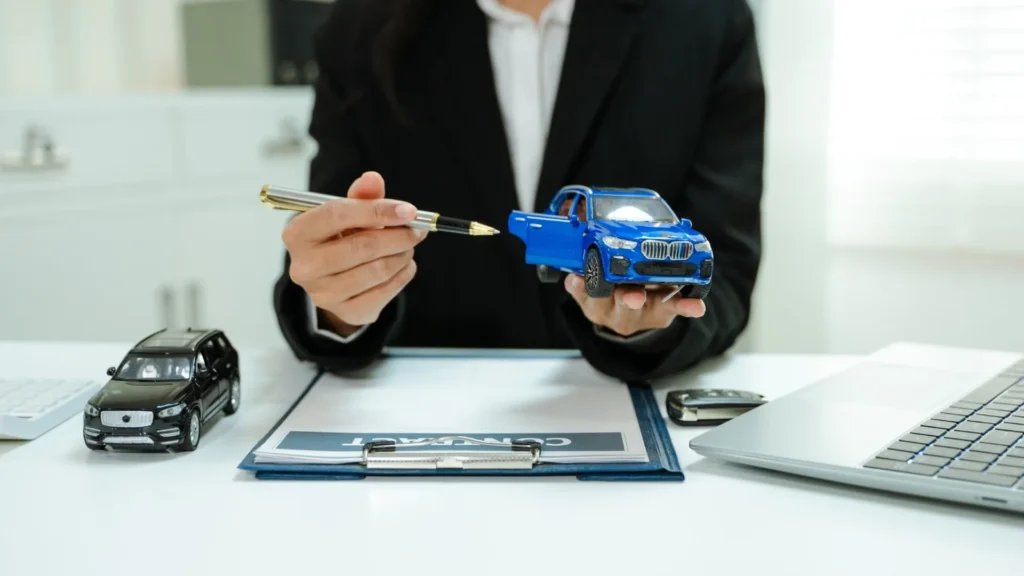 Vehicle title paperwork and car keys prepared for a Nevada vehicle sale