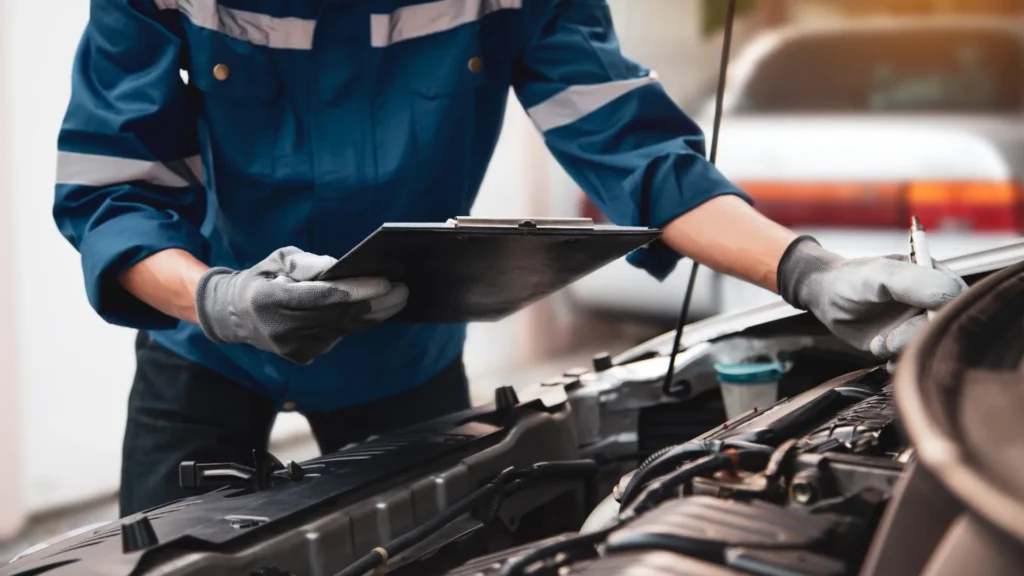 Older vehicle undergoing a failed safety inspection at a garage
