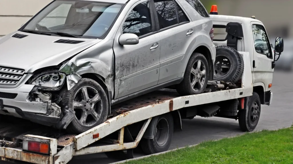 Older damaged vehicle awaiting professional pickup