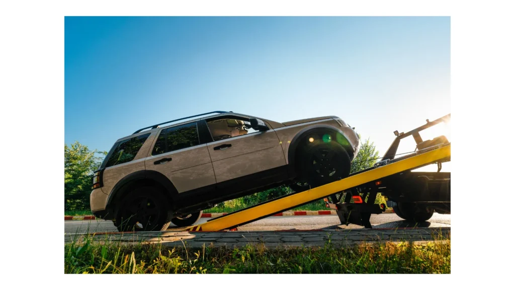Broken car on tow truck