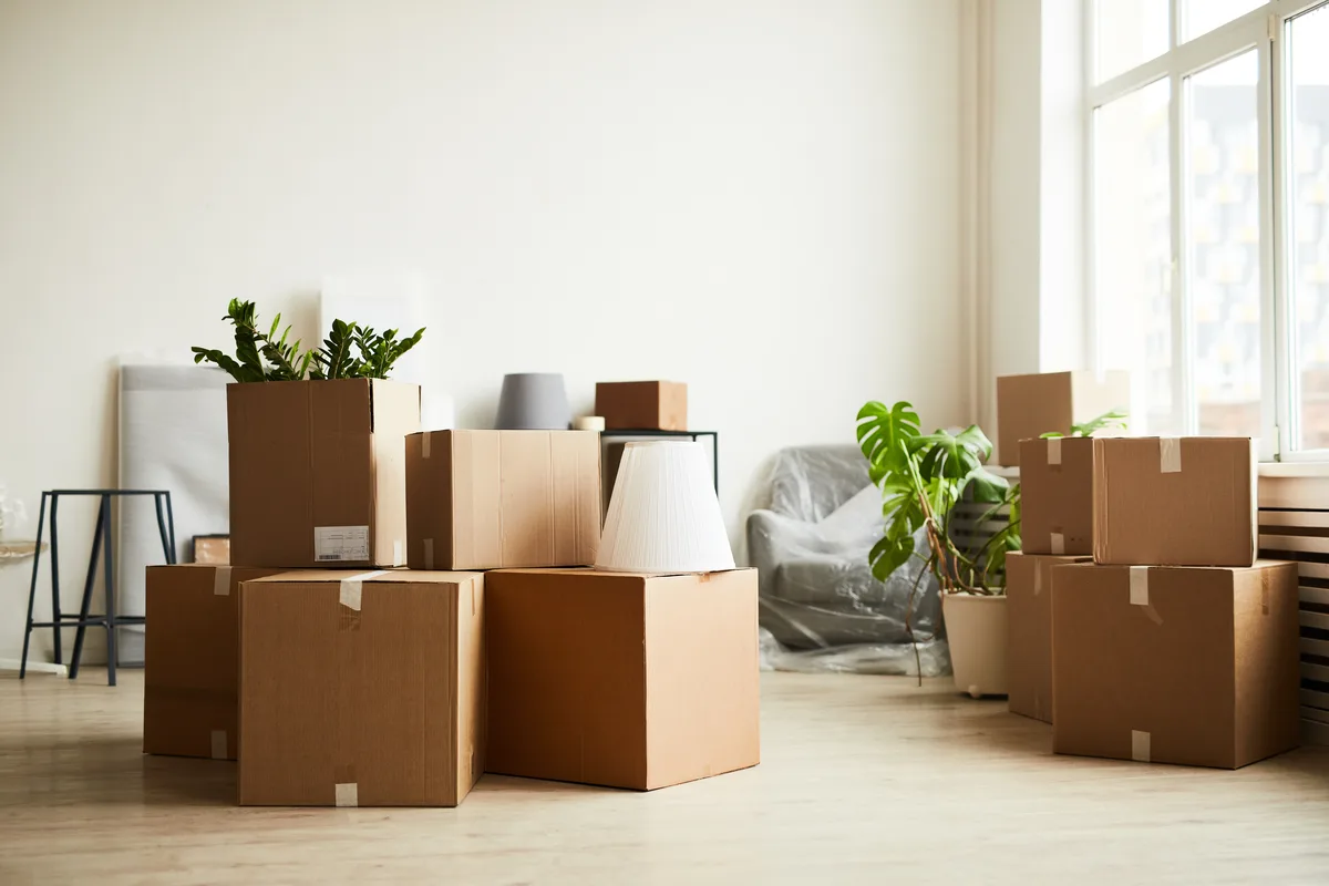 Moving boxes in an empty room after relocating to Pennsylvania