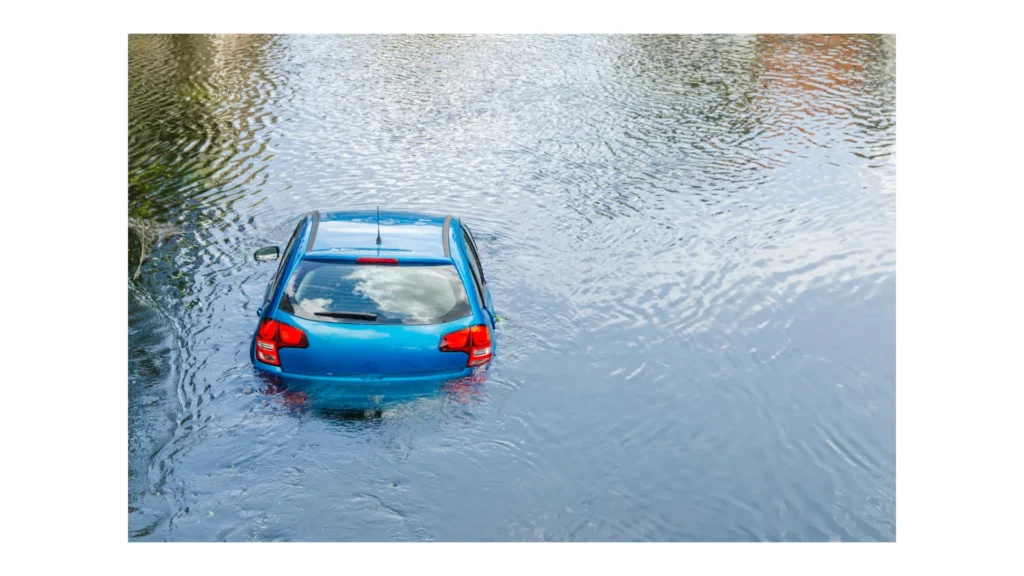 Blue car drown in water canal. Extreme accident vehicle sink in river pound lake, traffic incident