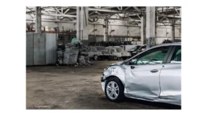 Many unknown altered wrecked car after traffic accident crash at restore service maintenance station garage indoor. Insurance salvage