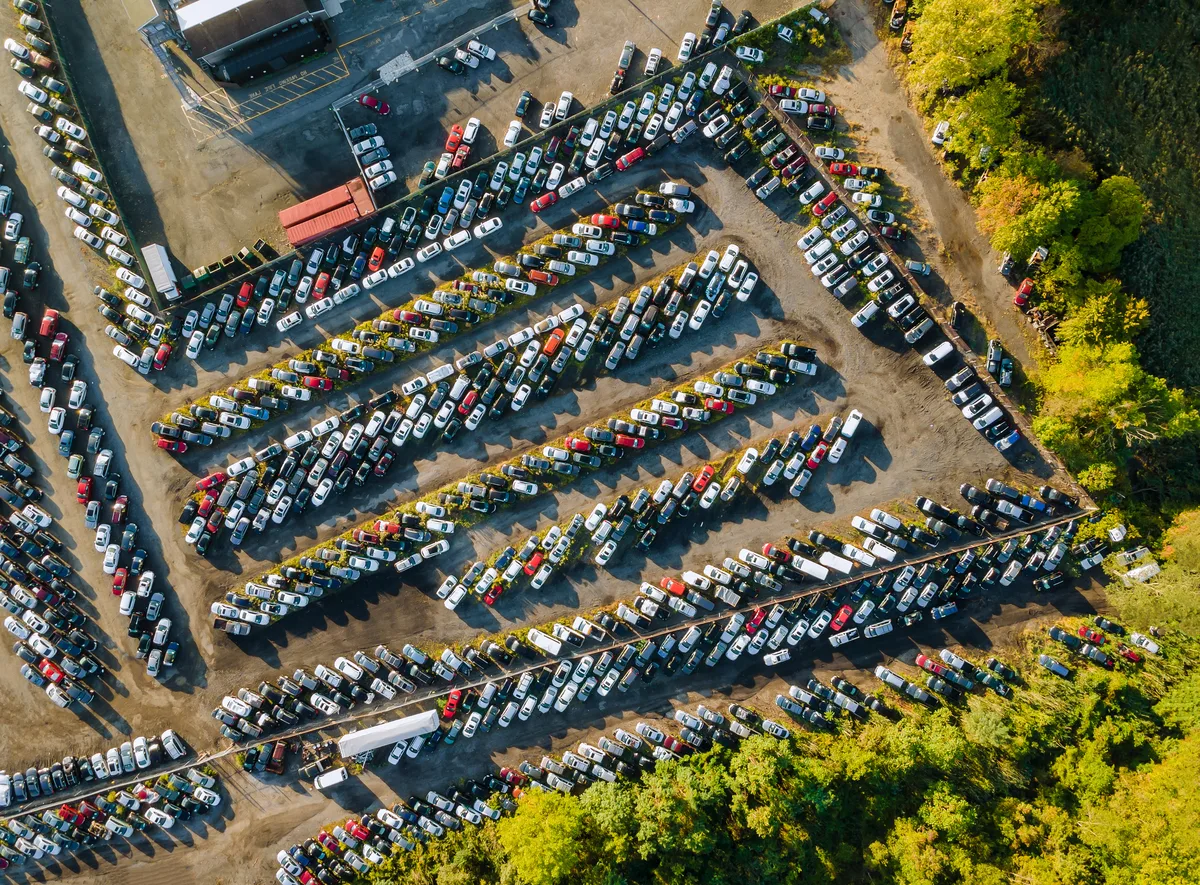 Rows of used and end-of-life cars that vary widely in weight