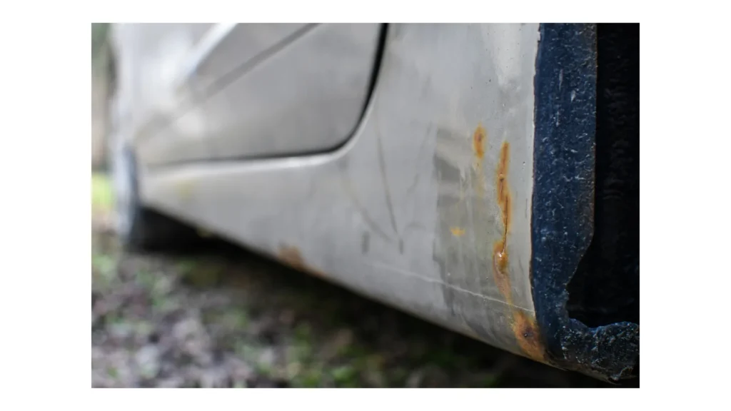 Signs of car corrosion or rust appearing on the bottom of the car