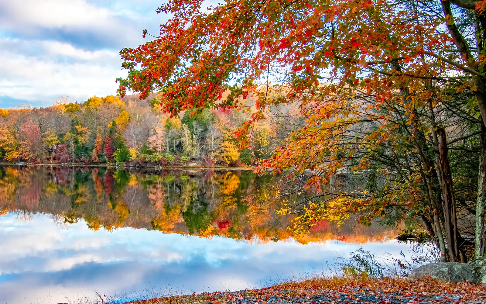 Fall foliage reflected in a lake in the Pocono Mountains, Pennsylvania